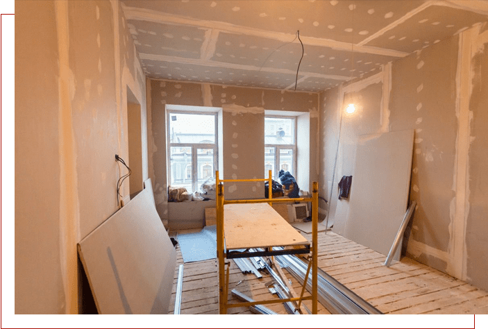 A room being remodeled with scaffolding in the foreground.