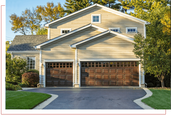 A large brown garage door in front of a house.